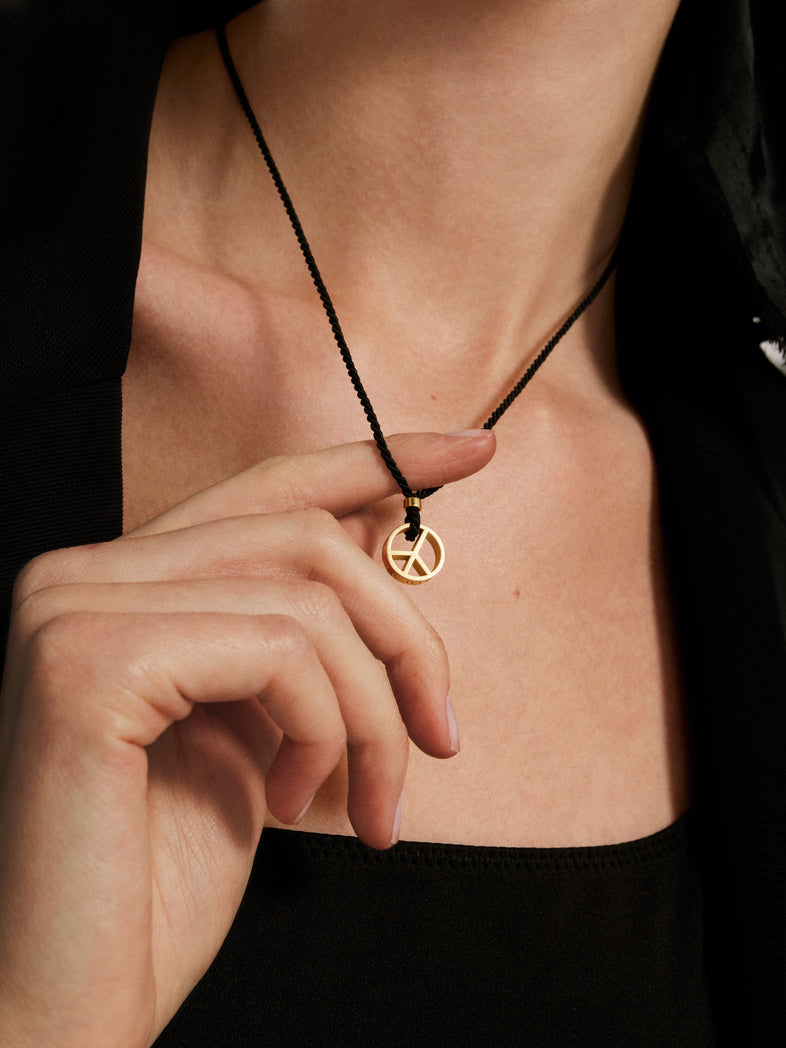  Black string necklace with a gold-plated peace 1 