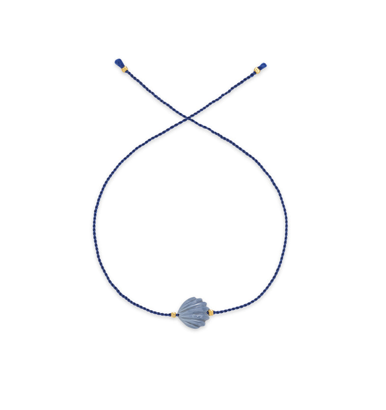  A bracelet on a blue string with a large blue shell 