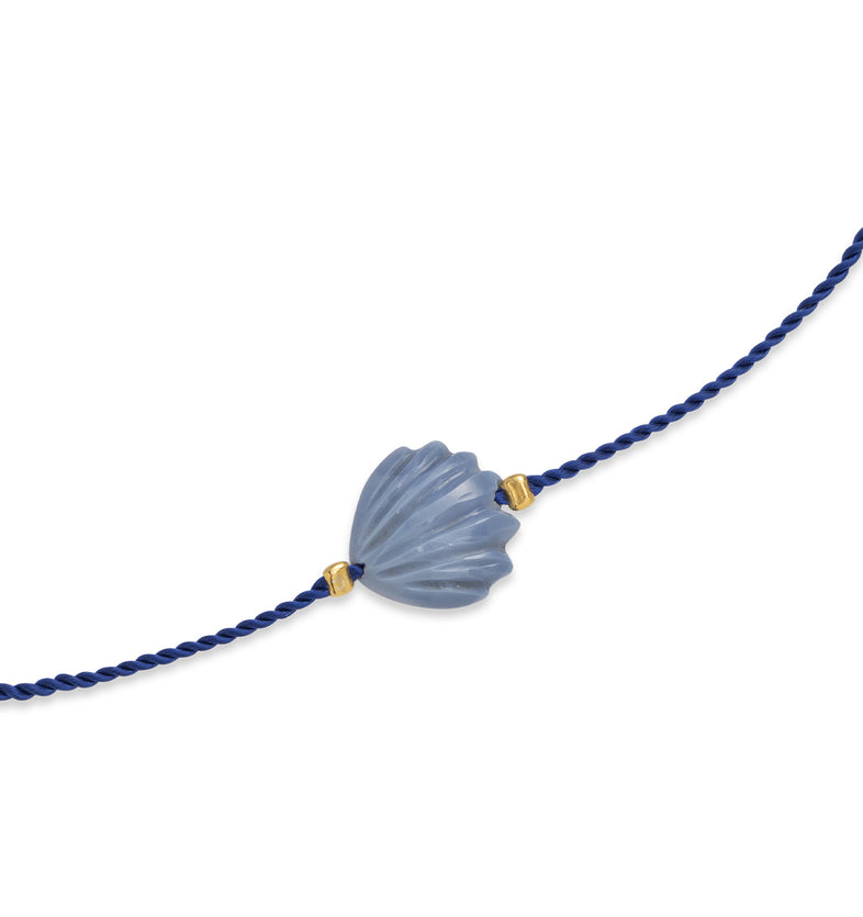  A bracelet on a blue string with a large blue shell 2 