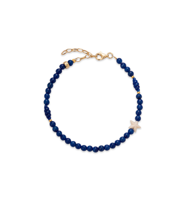  Bransoletka z granatowych koralików z zawieszką w kształcie białej gwiazdki i pozłacanym zapięciem karabińczykowym 