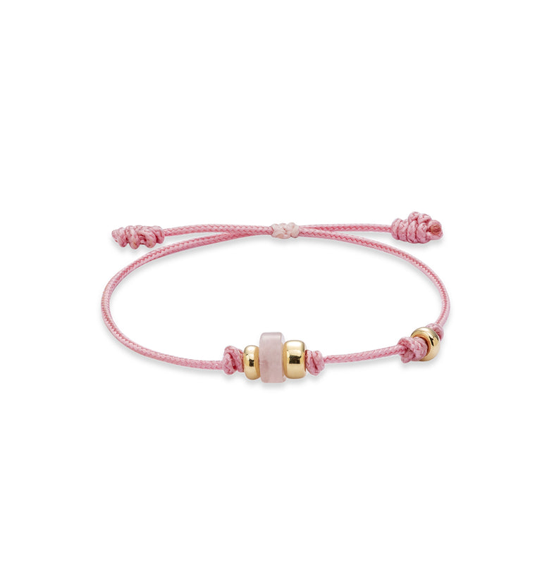  Jasnoróżowa bransoletka na sznurku z kwarcem różowym i pozłacanymi kulkami 