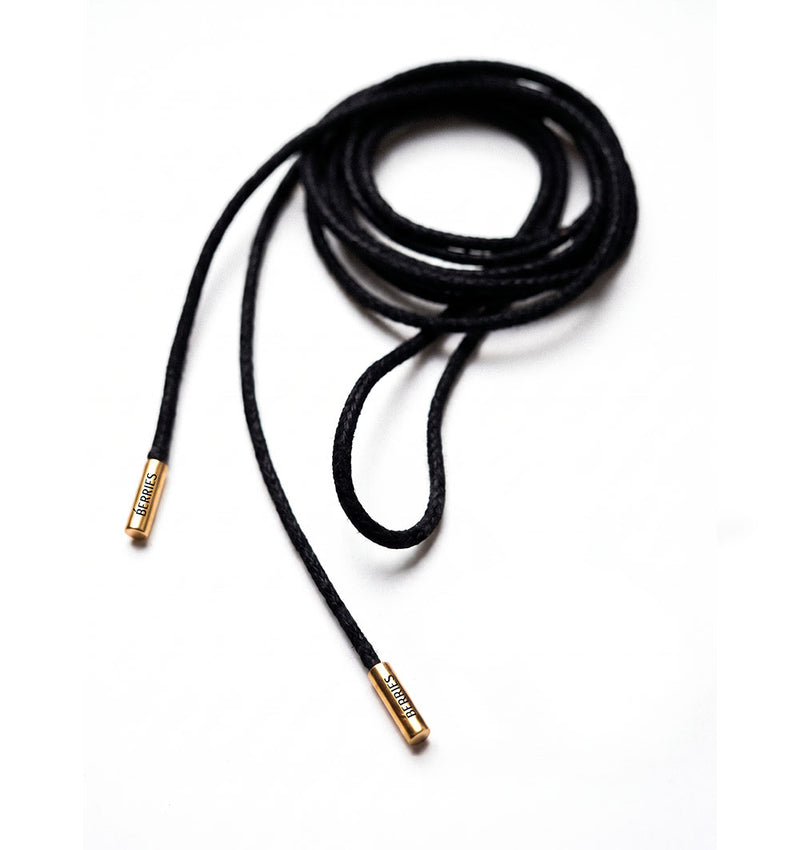 Black cord necklace with gold-plated tubes